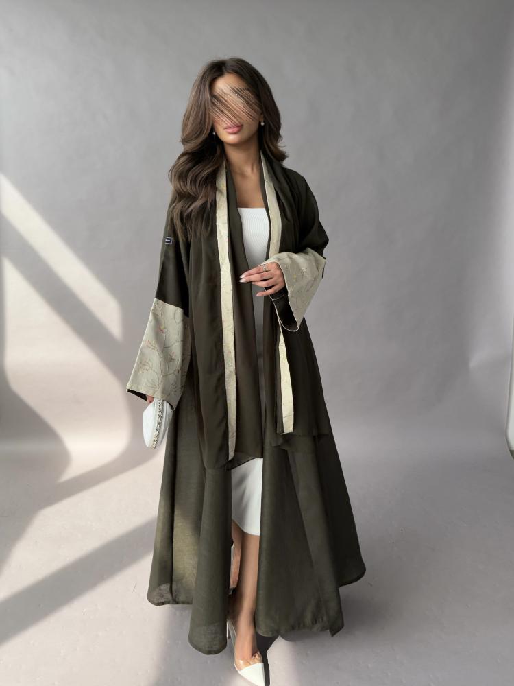 Abaya made of linen fabric, olive color, cuff edges in beige embroidered, flared style