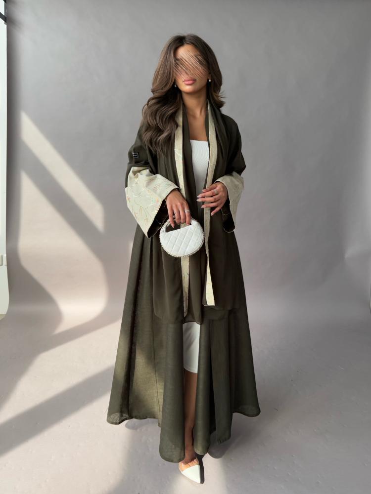 Abaya made of linen fabric, olive color, cuff edges in beige embroidered, flared style
