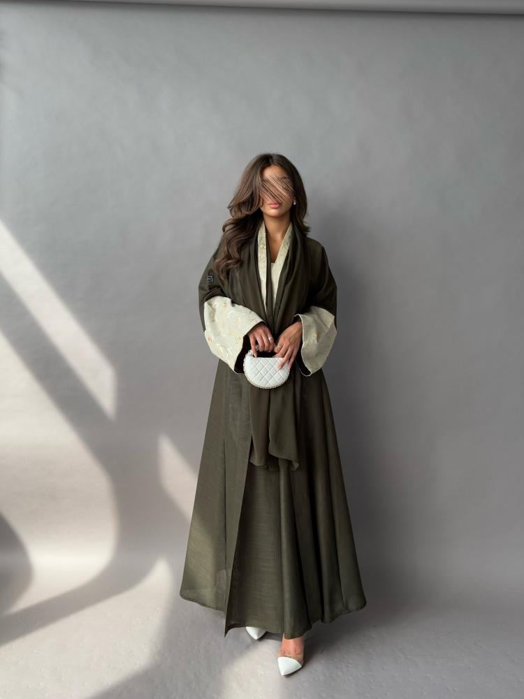 Abaya made of linen fabric, olive color, cuff edges in beige embroidered, flared style