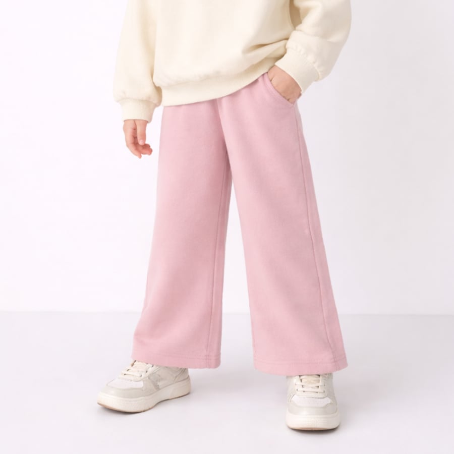 Girls' pants with a wide cut at the bottom - pink