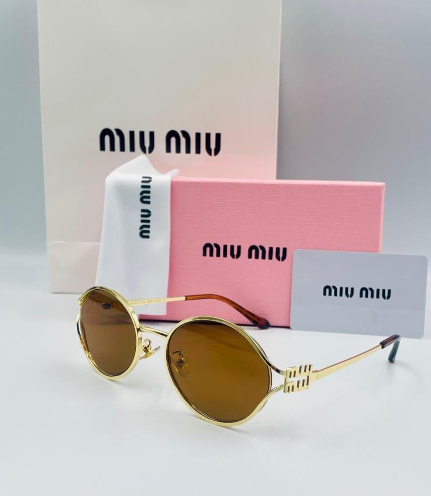 نظارة Miu Miu بني اطار ذهبي
