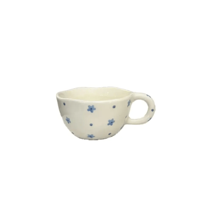 A cup and a plate decorated with flowers