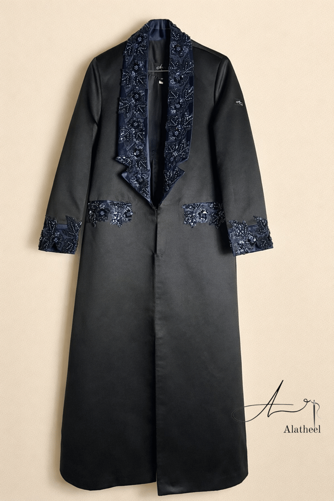 A thobe, Feteet Sila, black with navy blue, with embroidery and a slit at the back