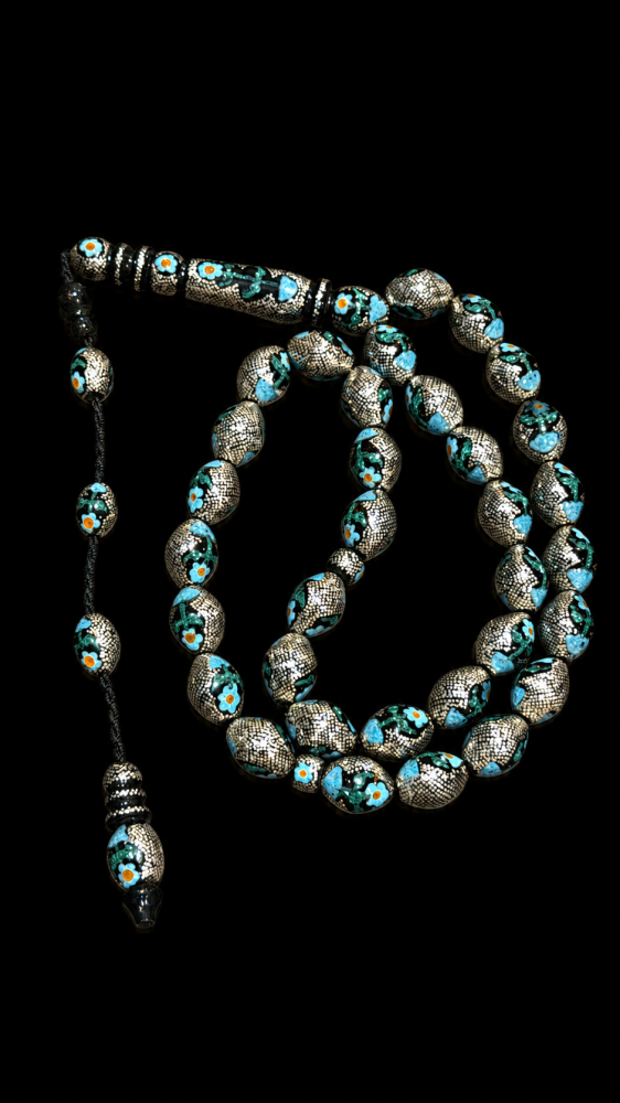 A prayer bead from natural Yasser weighing 82 grams decorated with turquoise and silver