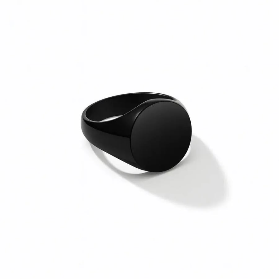 A stainless steel ring in black color, available in multiple sizes (laser engraving)