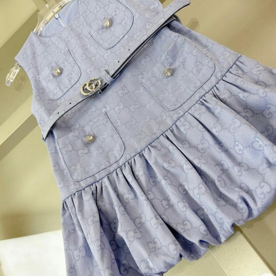 Girls' dress with elegant details and a blue belt