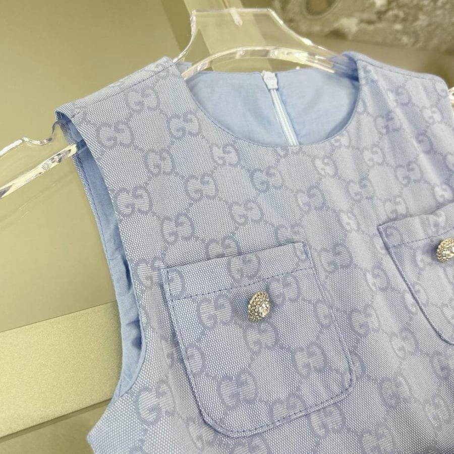 Girls' dress with elegant details and a blue belt