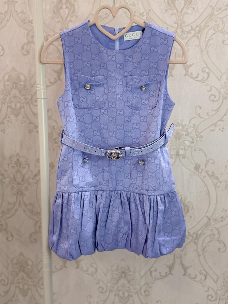 Girls' dress with elegant details and a blue belt