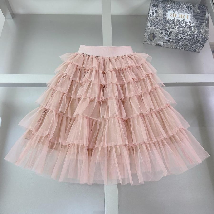 Girls' dress made of very luxurious layers with the belt