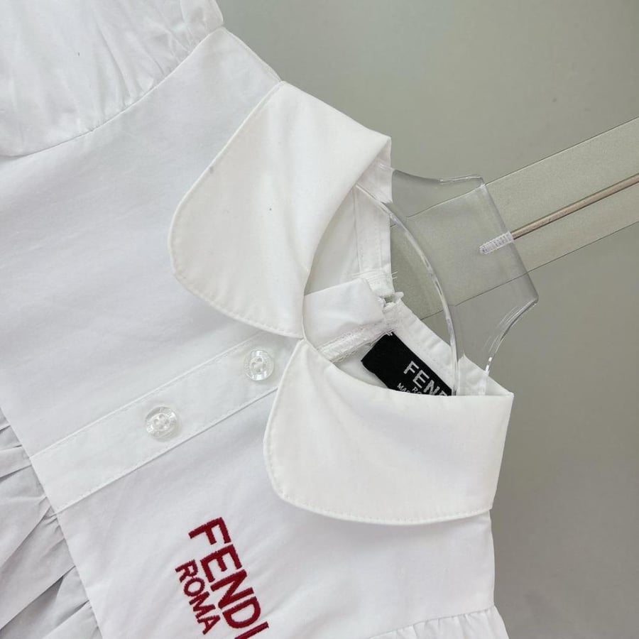 Girls' dress luxurious with embroidery of the brand logo on the chest