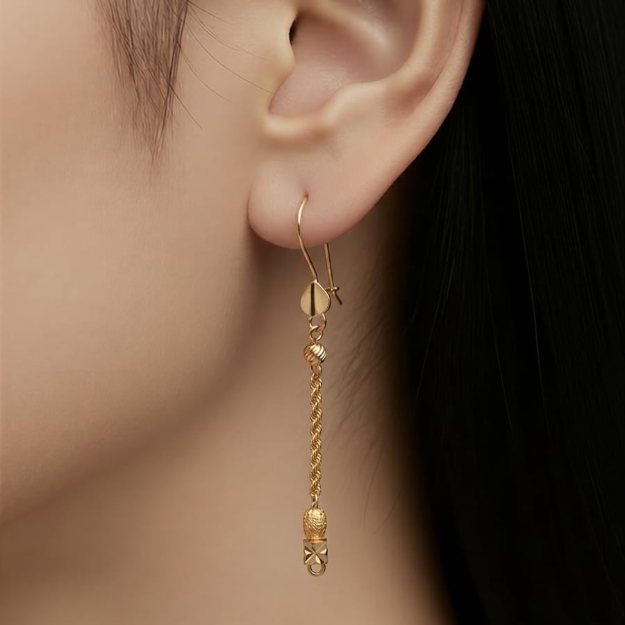 21-karat gold earrings, weighing 1.80 grams