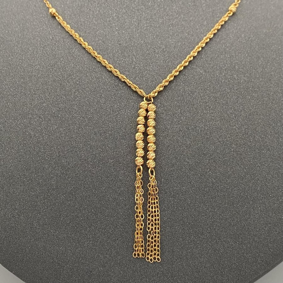 21-karat gold necklace, weighing 2.77 grams