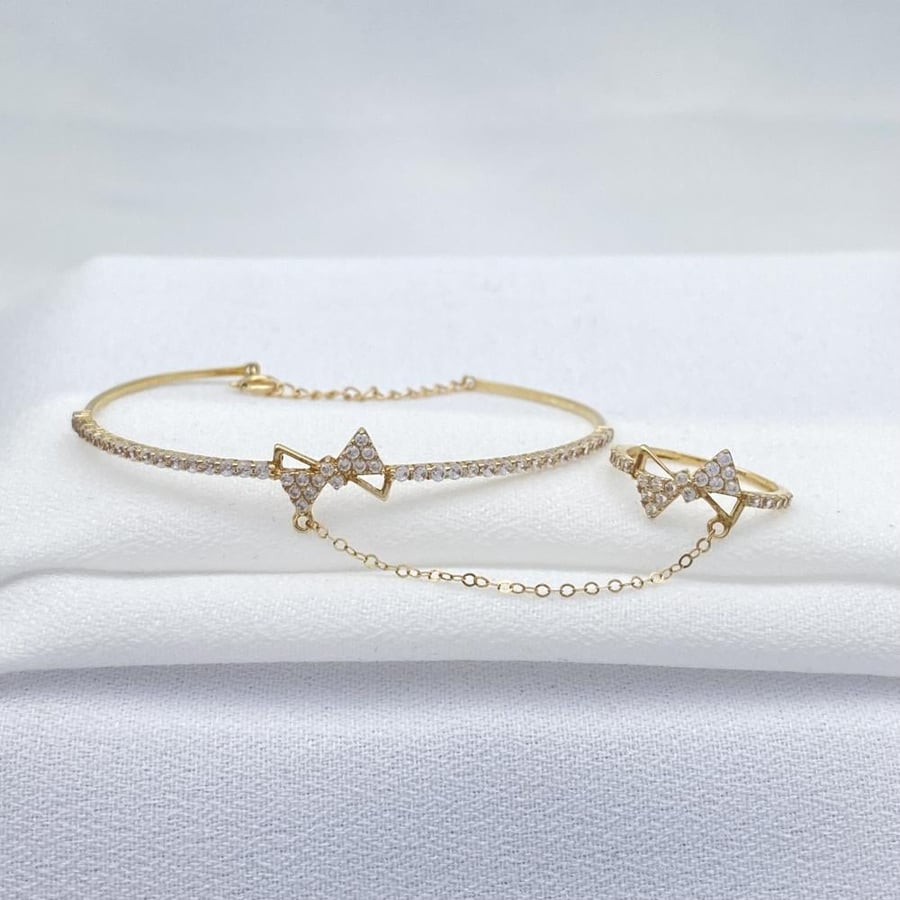 18k gold baby bracelet and ring, weighing 2.60 grams