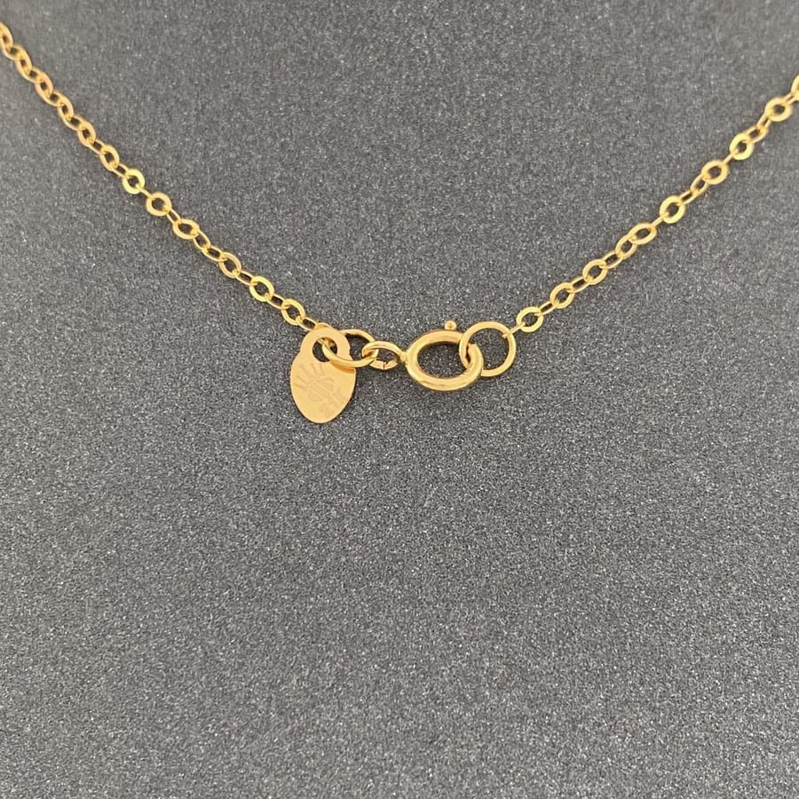 21-karat gold necklace, weighing 2.77 grams