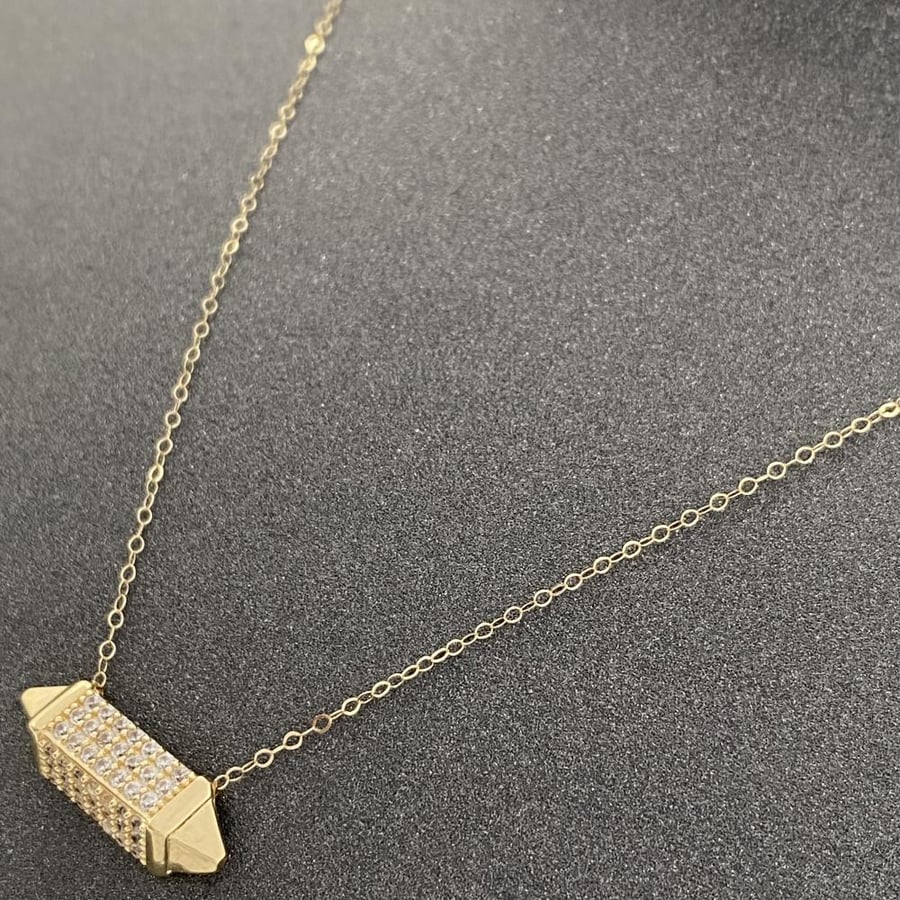18-karat gold necklaces, weighing 3.10 grams
