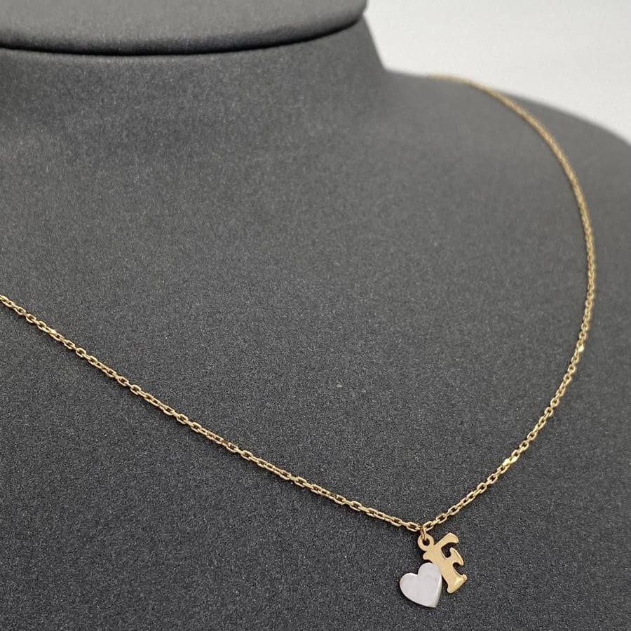 Letter F, 18k gold, weight 1.71 grams
