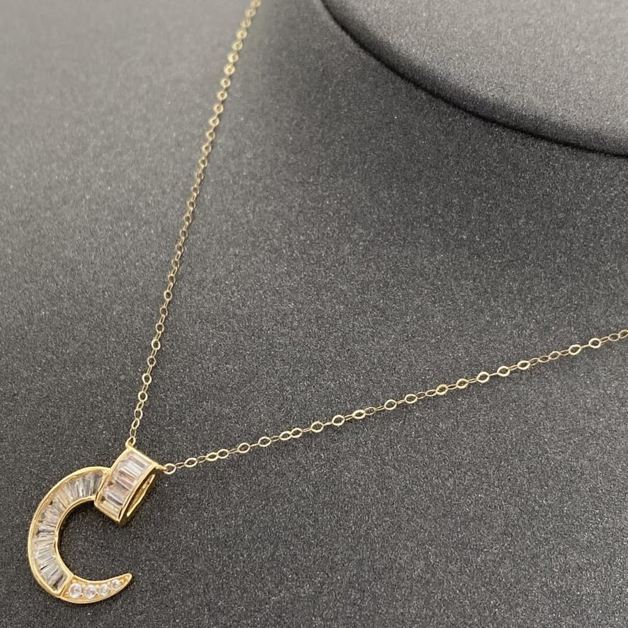 18-karat gold necklaces, weighing 3.14 grams