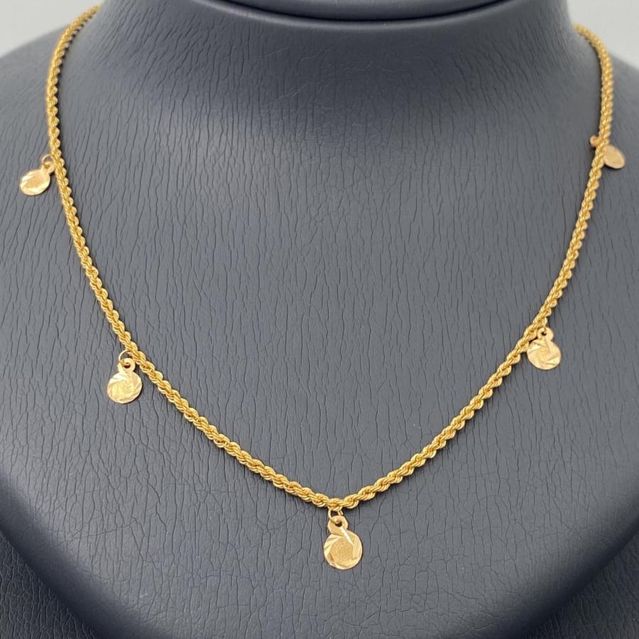 21 karat gold set, weight 8.72 grams