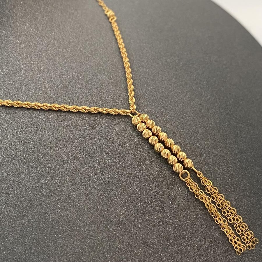 21-karat gold necklace, weighing 2.77 grams