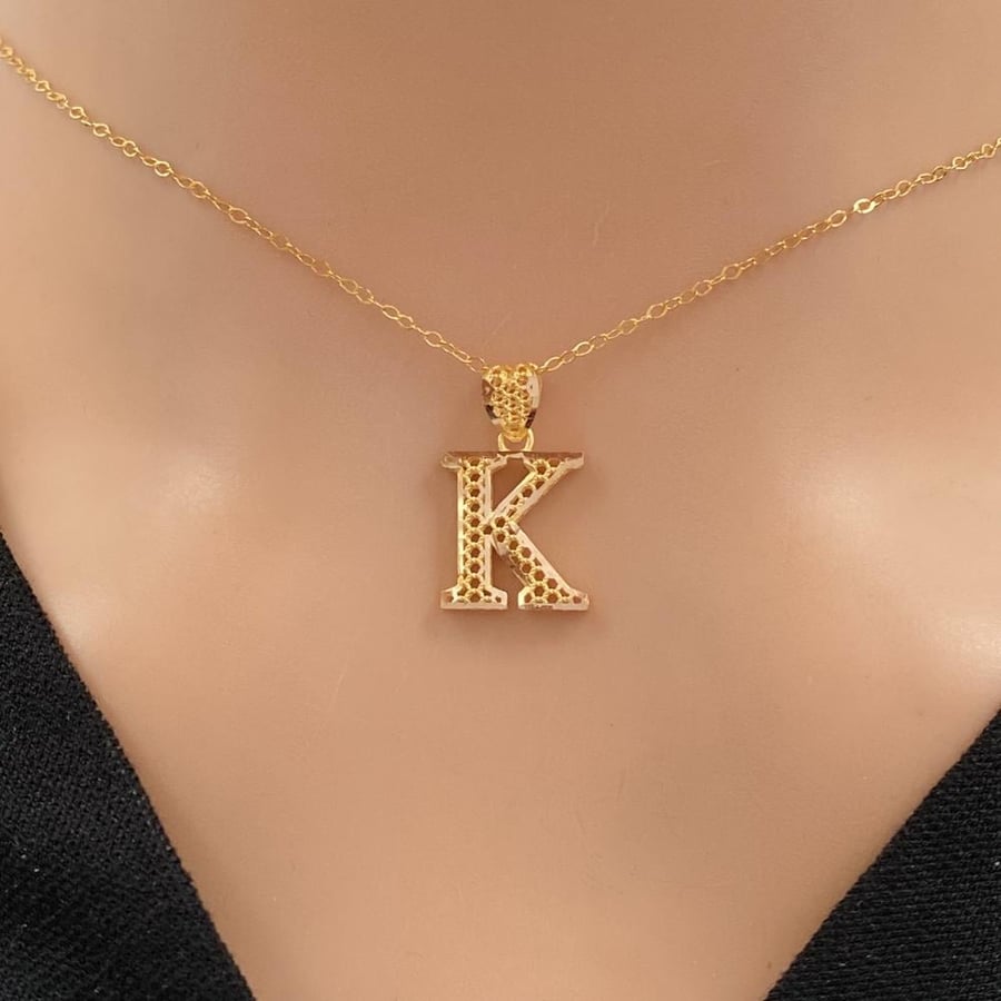 Letter K, 21 karat gold, weight 1.48 grams