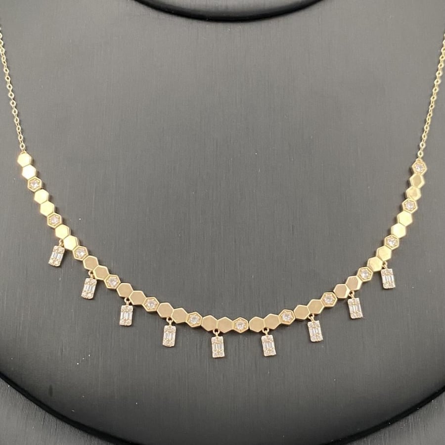 A Chaumet 18-karat gold set weighing 11.19 grams with matching pendants that tell the story of your elegance