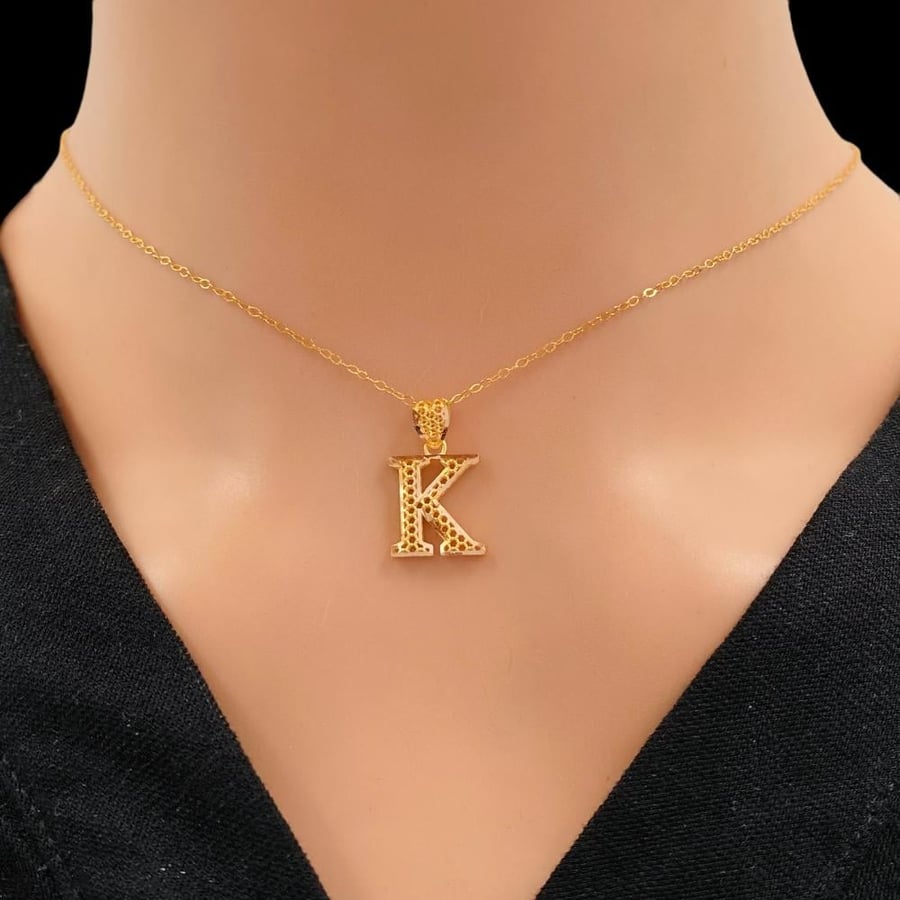 Letter K, 21 karat gold, weight 1.48 grams