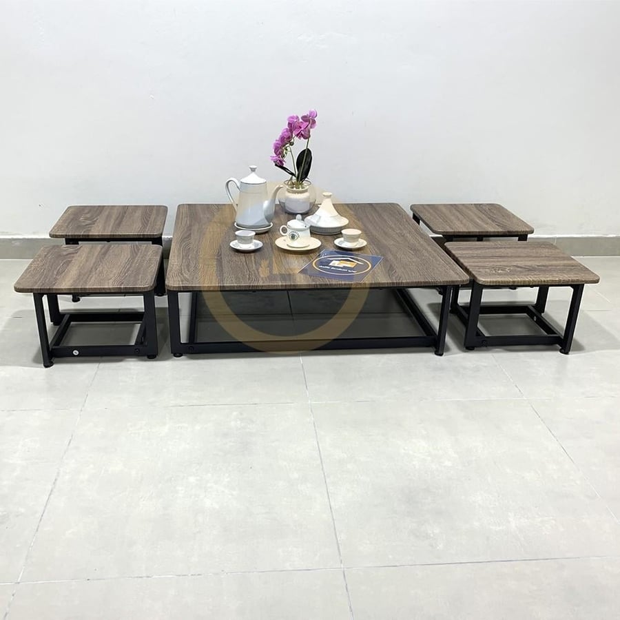 A set of ground tables, one large table and four service tables