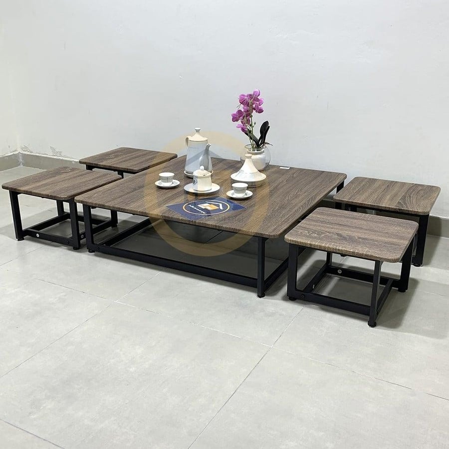 A set of ground tables, one large table and four service tables