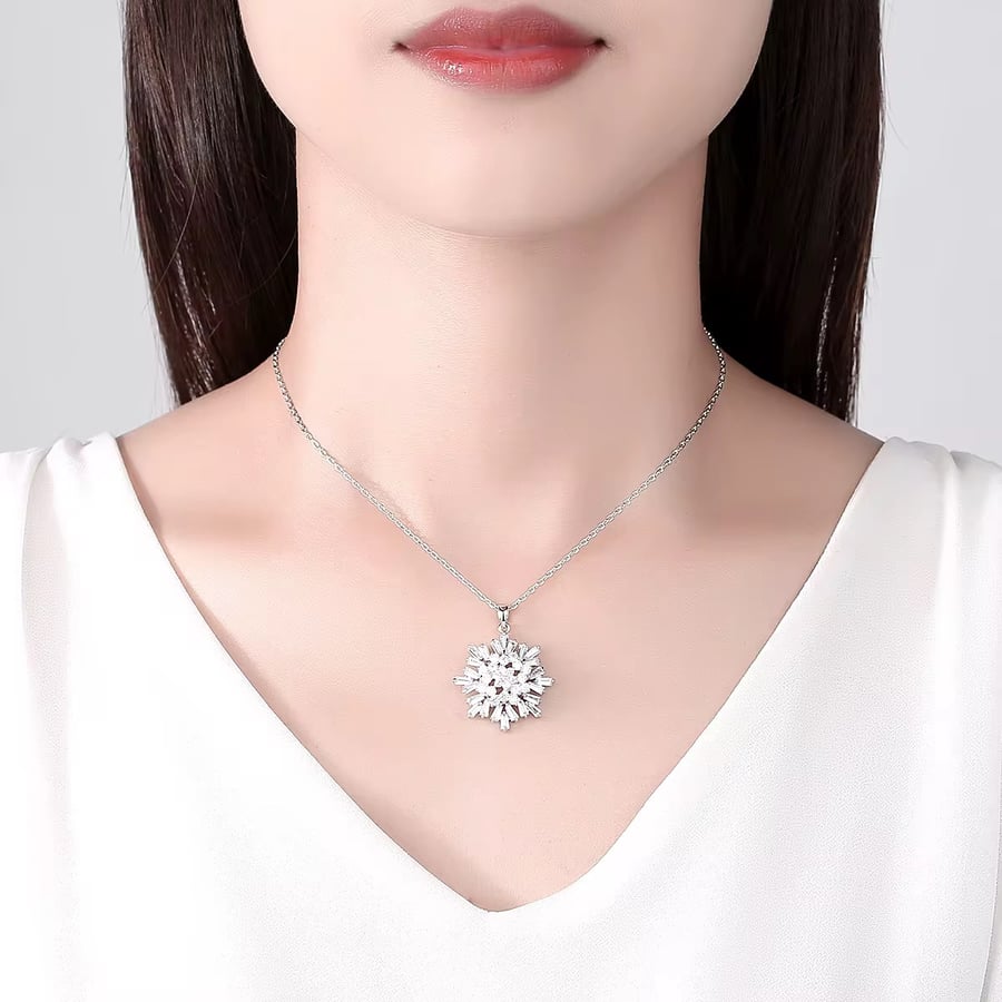 Luxurious necklace with a chain and pendant encrusted with zircon and plated with white gold