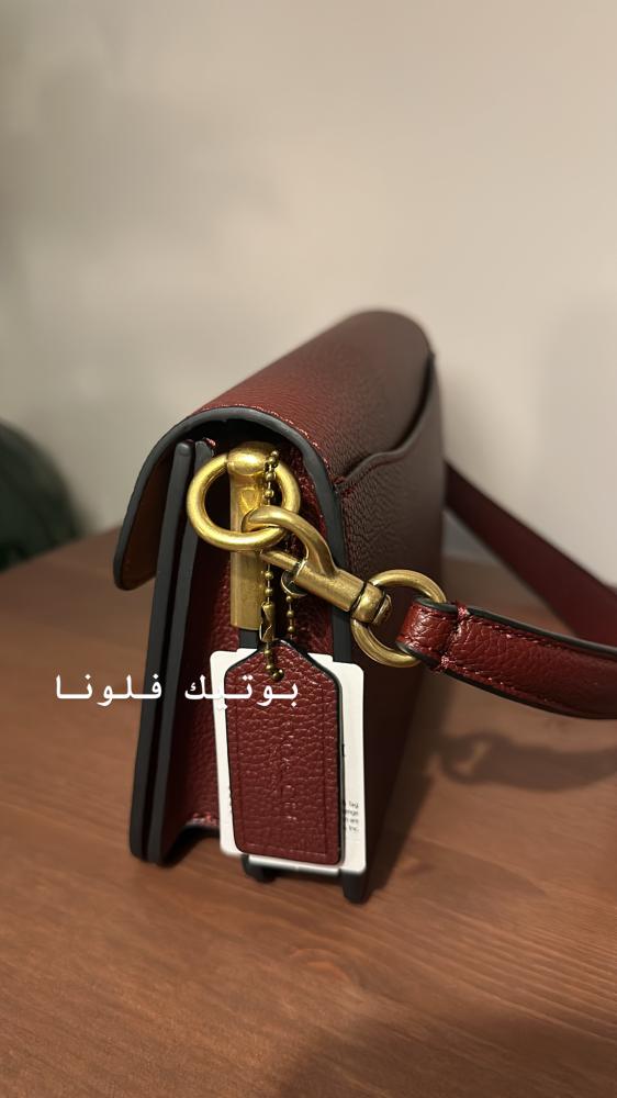 شنطة يد عنابي