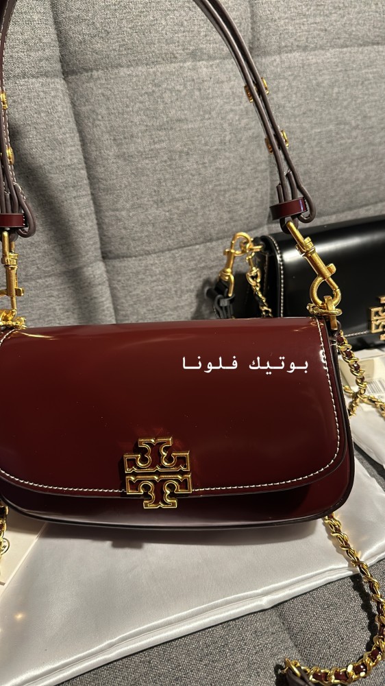 شنطة يد عنابي