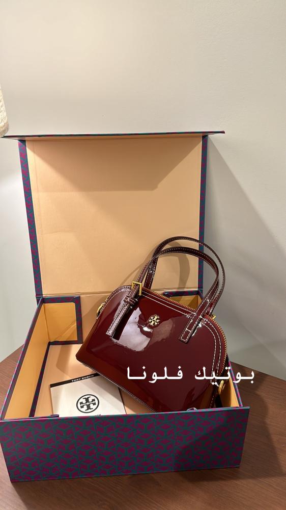 شنطة يد عنابي