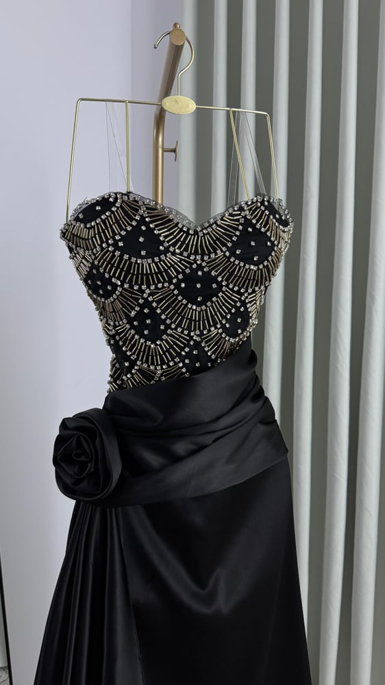 Evening dress with hand embroidery, beads, and crystal stones