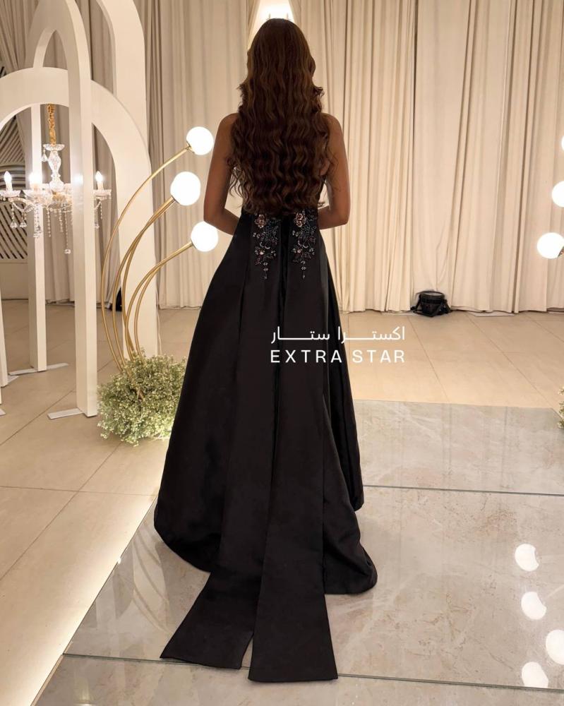 Evening dress with a train and computer embroidery