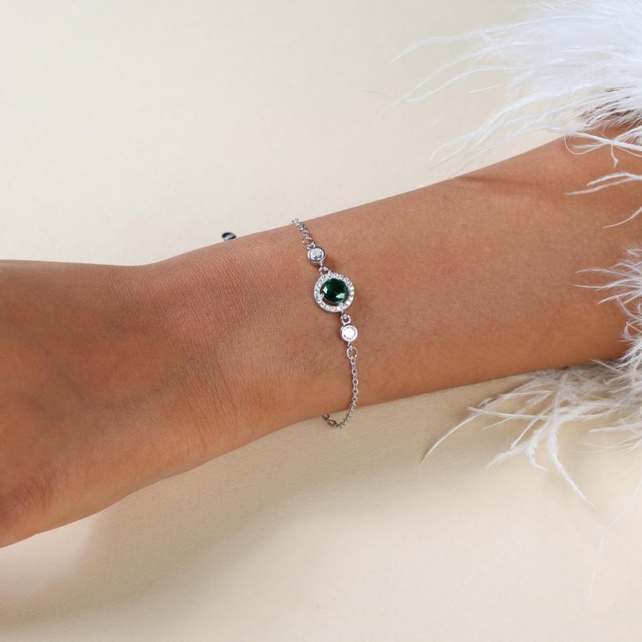 Silver bracelet with green zircon stone