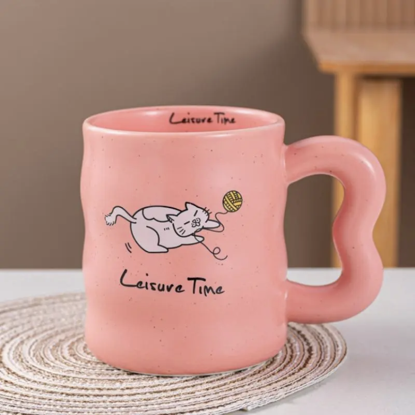Ceramic mug with a cat design in pink color