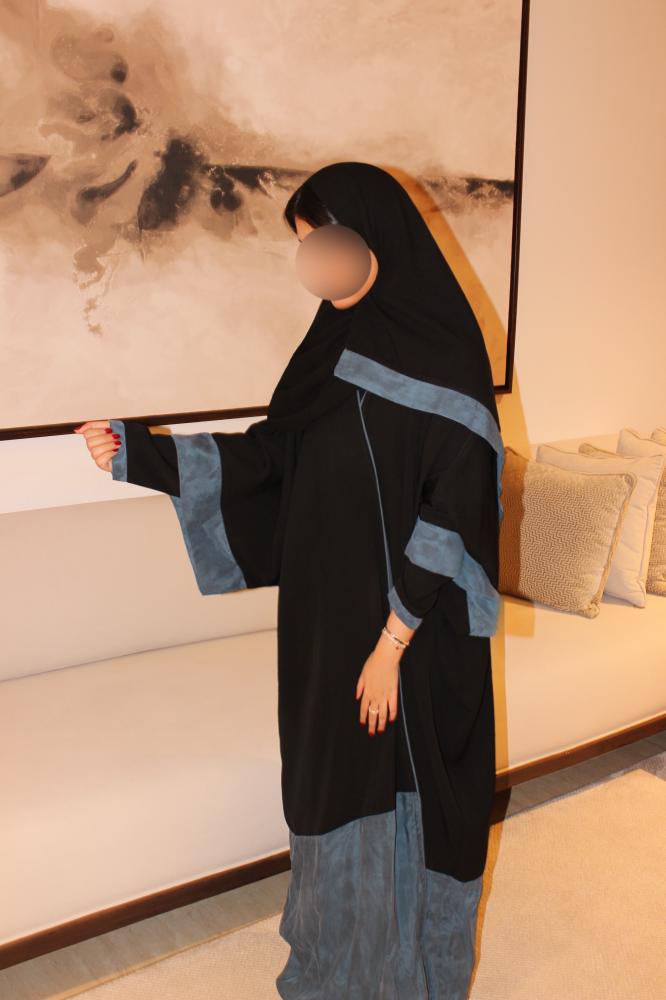 Double-sleeve abaya combining black Korean crepe with dusty blue washed Turkish silk.