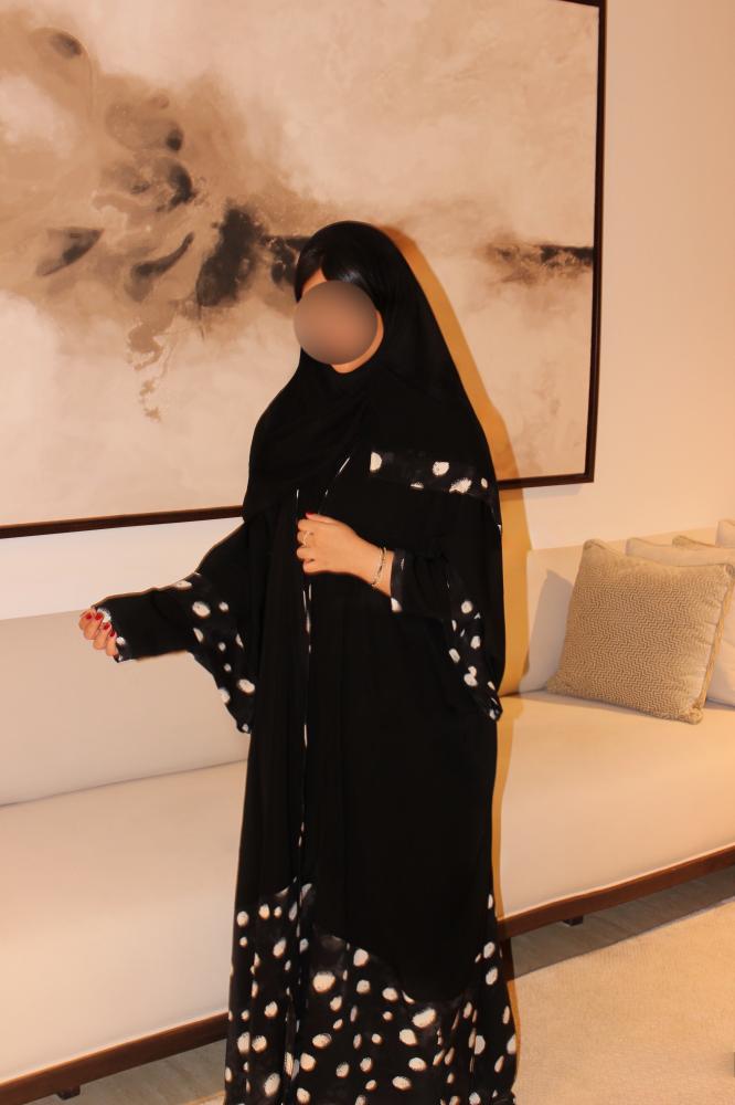 Double-sleeve abaya combining charcoal black Korean blackberry fabric with black and white polka dot silk.