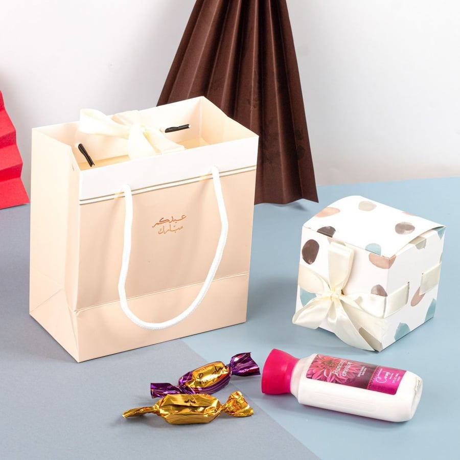 Luxurious Eid bags in beige and white color with the stamp "Eid Mubarak
