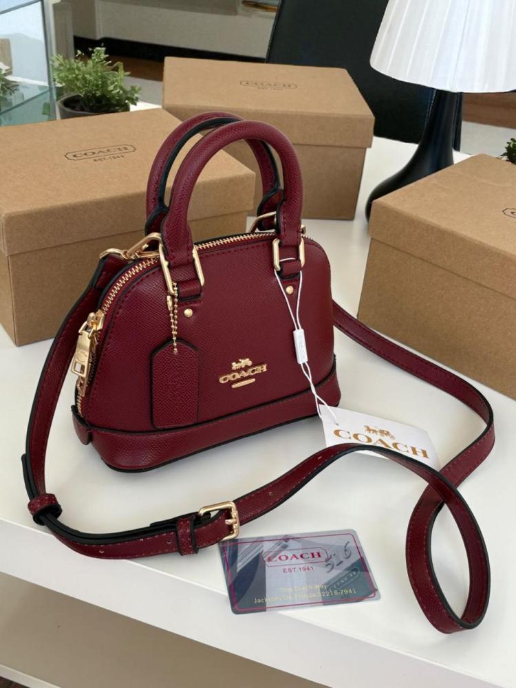Mini Coach bags with the brand box