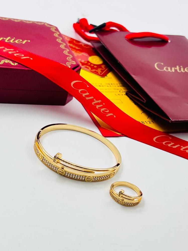 Cartier set, bracelet with ring, gold and silver