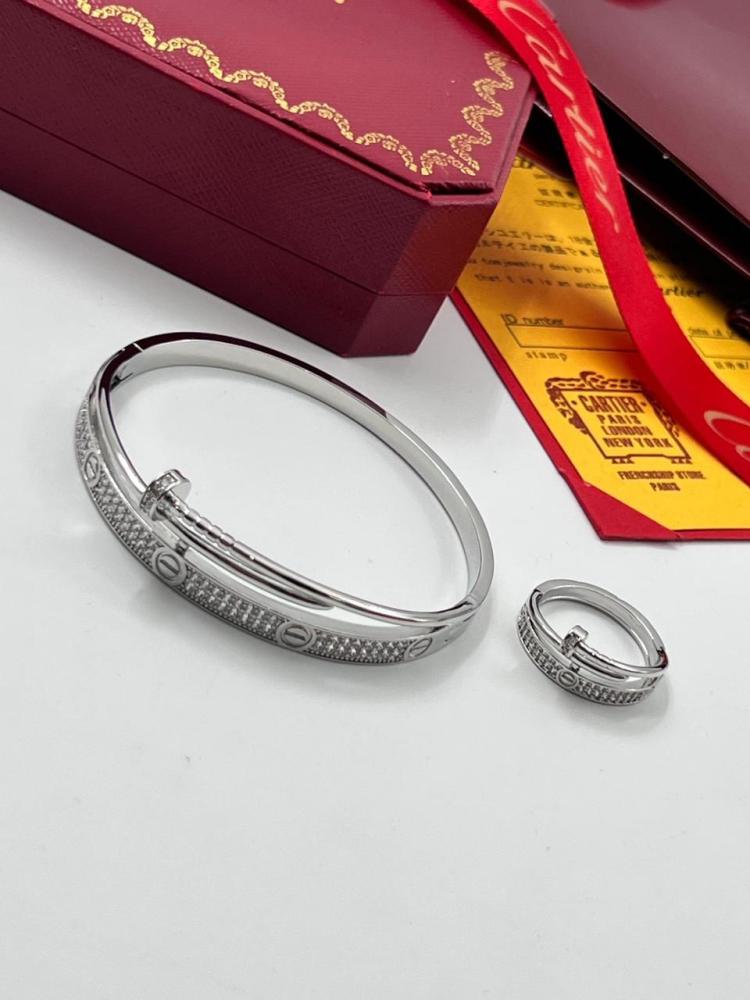 Cartier set, bracelet with ring, gold and silver