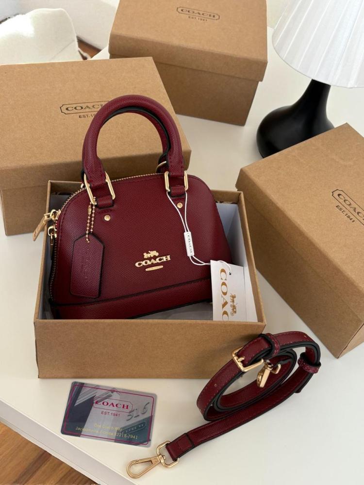 Mini Coach bags with the brand box