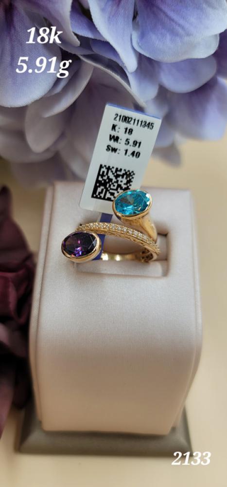Gold ring with two turquoise and purple stones, 18 karat