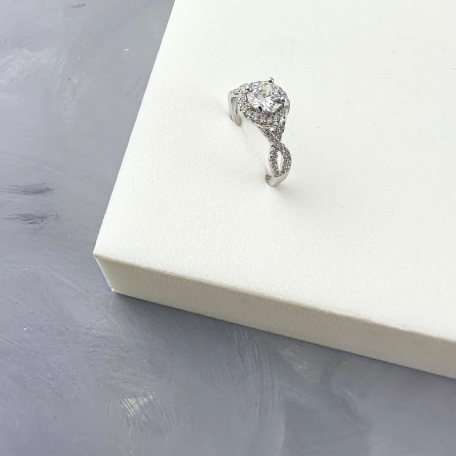Silver ring set with zircon