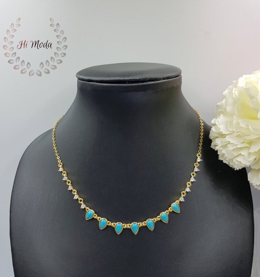Gold zircon set adorned with artificial turquoise
