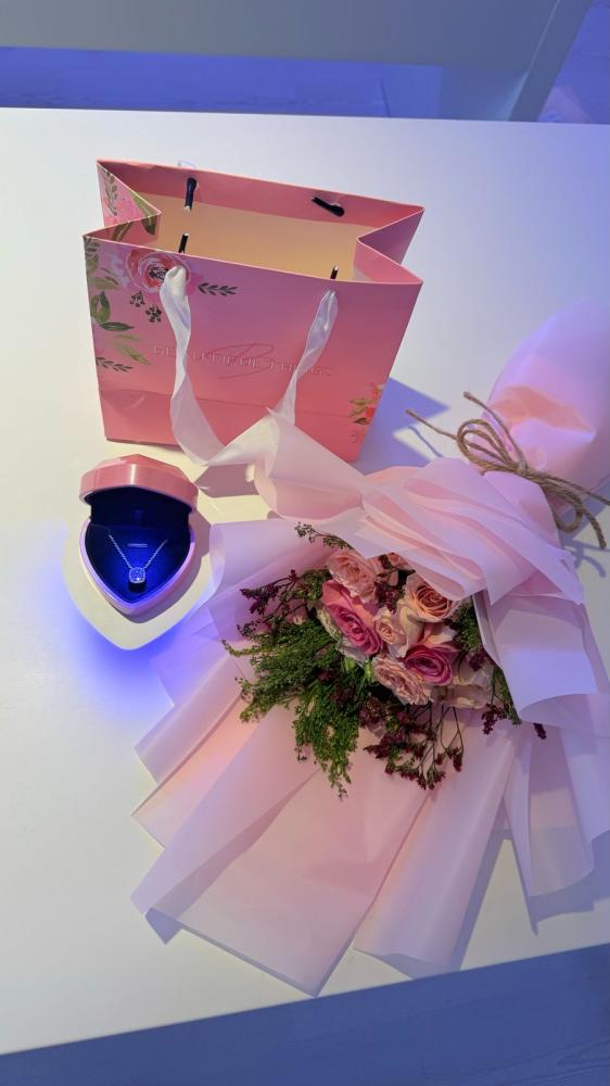 A bouquet of flowers with the Jewel pendant