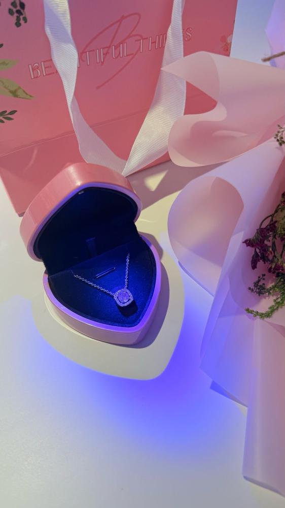 A bouquet of flowers with the Jewel pendant