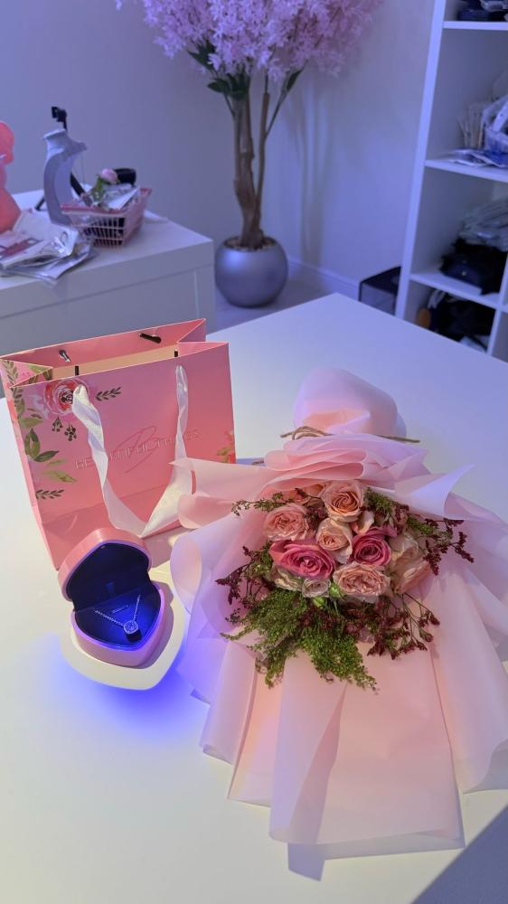 A bouquet of flowers with the Jewel pendant