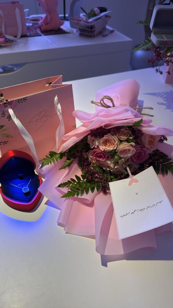 A bouquet of flowers with the Jewel pendant